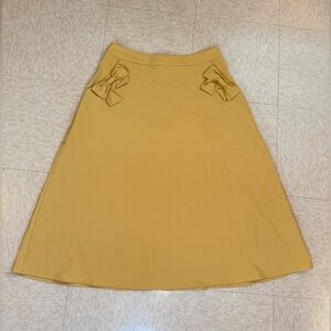 Collectif Mustard A-Line Skirt with Bow Accents